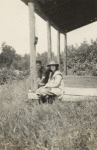 Frederick V. Field and young woman sitting on porch