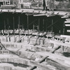Elia Kazan and unidentified man looking at construction of Vivian Beaumont Theatre at Lincoln Center