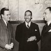 Roi Ottley with unidentified men