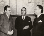 Roi Ottley with unidentified men