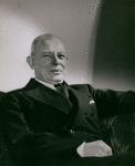 Gilbert H. Montague seated