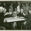 Service men seated at table having coffee