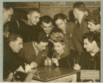 Janet Blair surrounded by service men at Stage Door Canteen of Philadelphia.