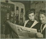 Service men reading the newspaper