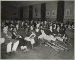 Wounded service men watching a show.