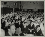 Service men sitting in audience watching a show.