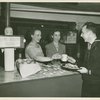 "One Dessert Please!" - Hostesses giving sailor coffee and fruit.