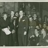 Helen Menken, Mrs. Roosevelt and Milton Berle at CBS microphone surrounded by service men.
