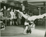 Female dancers performing for service men and hostesses