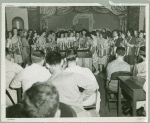Hostesses surround pianst