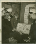Service men taking "FREE Souvenir Post Cards"