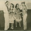 Bette Davis and Helen Menken shaking hands with service men.