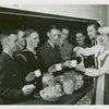Vincent Price and Gertrude Lawrence serving refreshments to servicemen at American Theatre Wing Stage Door Canteen, New York City, ca. 1943.