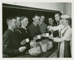 Vincent Price and Gertrude Lawrence serving refreshments to servicemen at American Theatre Wing Stage Door Canteen, New York City, ca. 1943.