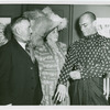 Yul Brynner (The King), right, with Bert and Beck Matthews, Pearly King and Queen, backstage at The King and I