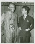 Yul Brynner (The King) and Prince Sukhsvasti of Thailand (?) backstage at The King and I