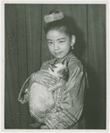 Carole Luna (Royal Child replacement) holding Somawadi the cat backstage at The King and I