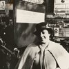 Entertainer and nightclub owner Ada "Bricktop" Smith posing next to sign outside her club, Paris, France
