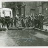 Group of Harlem youths recruited as street sweepers on 117th Street, ca. 1940s