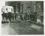 Group of Harlem youths recruited as street sweepers on 117th Street, ca. 1940s