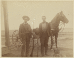 Two hunters with dead birds, horse and dog