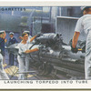 Launching torpedo into tube.
