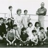 Risë Stevens [seated at center] and Darren McGavin [standing at right] and ensemble of child performers in publicity pose for the 1964 Lincoln Center revival of The King and I