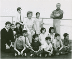 Risë Stevens [seated at center], Darren McGavin [standing at right] and ensemble of child performers in publicity photo for the 1964 Lincoln Center revival of The King and I
