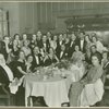 Tatiana Chamié in a group photo around dining table