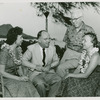 James Michener (author of Tales of the South Pacific which was the basis for the musical South Pacific) second from left, with Lorraine Santschi (Nellie Forbush in the Honolulu Community Theatre's 1955 production of South Pacific), Arthur Sircom (director of same production) and unidentified woman