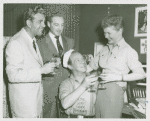 George Britton (Emile De Becque replacement), William Hammerstein, Martha Wright (Nellie Forbush replacement) and Myron McCormick (Luther Billis) at McCormick's birthday celebration in his dressing room at South Pacific