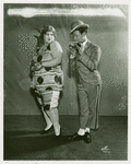 Belle Baker (as the title character of Betsy) with Borrah Minnevitch (Minevitch), leader of the Harmonica Symphony Orchestra