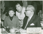 Miyoshi Umeki (Mei Li), Juanita Hall (Madam Liang) and Oscar Hammerstein II (lyrics) at an anniversary party for Flower Drum Song