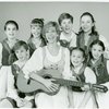Back row: Kia Graves (Brigitta), Kelly Karbacz (Louisa), Richard A. Blake (Friedrich) and Emily Loesser (Liesl) Front row: Ted Huffman (Kurt), Debbie Boone (Maria Rainer), Lauren Gaffney (Marta) and Marry Mazzello (Gretl) in the 1990 revival of The Sound of Music]