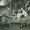 Ezio Pinza (Emile de Becque), Barbara Luna (Ngana), Michael or Noel DeLeon (Jerome) and Mary Martin (Nellie Forbush) in South Pacific