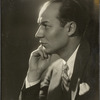 Ted Husing resting chin on hand
