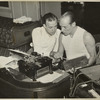 Ted Husing in T-shirt (right) with unidentified man leaning over him