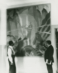 Artist Aaron Douglas (left) and Schomburg Collection curator Arthur A. Schomburg in front of Douglas's painting "Aspects of Negro Life: Song of the Towers"
