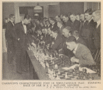 Champion's [Jose R. Capablanca] characteristic pose in simultanous play. Standing back of him is A.J. McClure, referee