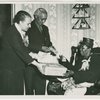 Mrs. Emma English declared Mother of the Year by New Jersey Civil Rights Congress, receiving gifts from Mr. Joseph Collins, community leader, Trenton, and Mrs. Remel Roberson, church leader and newspaperwoman, May 1950