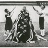 Felia Doubrovska as the Bride posed behind a pyramid of female dancers, flanked by an unidentified couple in rehearsal for Les Ballets Russes de Dyagilev production.