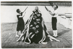 Felia Doubrovska as the Bride posed behind a pyramid of female dancers, flanked by an unidentified couple in rehearsal for Les Ballets Russes de Dyagilev production.