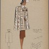 Cape of bold plaid with pleats in front only.