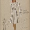 Box pleats down front start from yoke on bodice and from incrusted waistband on skirt.