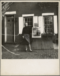 Eleanor Ward of the Stable Gallery with artworks by Robert Indiana and Andy Warhol