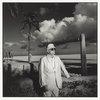 Man in suit on beach, Miami, 10/1986