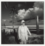 Man in suit on beach, Miami, 10/1986