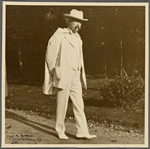 Six photographs of SLC strolling in white suit at Tuxedo, Aug. 1907. SLC with cigar, hands behind back.