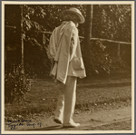Six photographs of SLC strolling in white suit at Tuxedo, Aug. 1907. SLC walking away, profile.