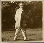 Six photographs of SLC strolling in white suit at Tuxedo, Aug. 1907. SLC walking away.